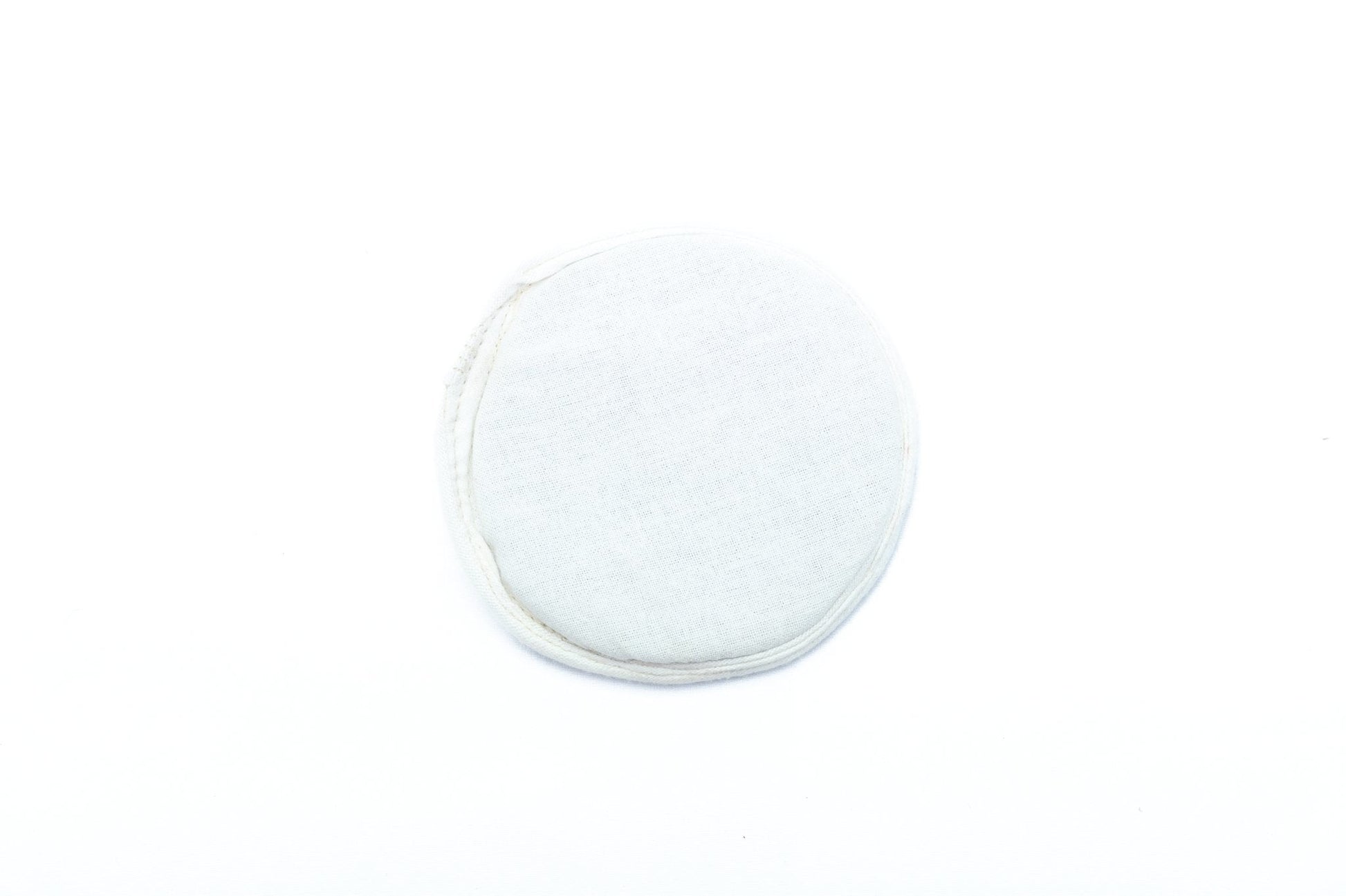 Flat singing bowl cushion in white