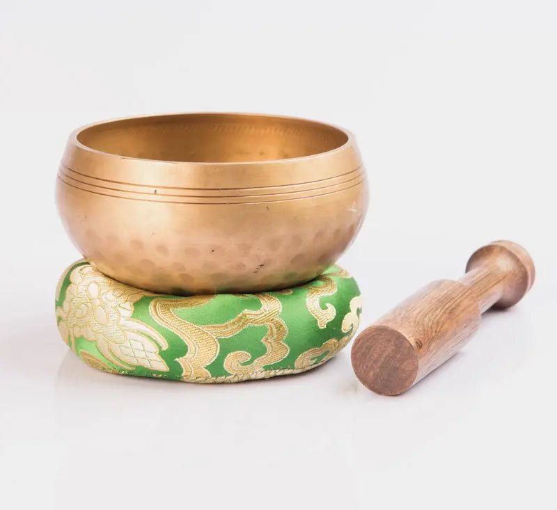 Hand - beaten brass singing bowl
