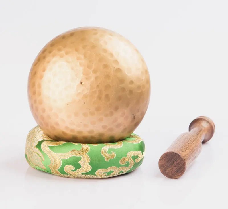 Hand - beaten brass singing bowl