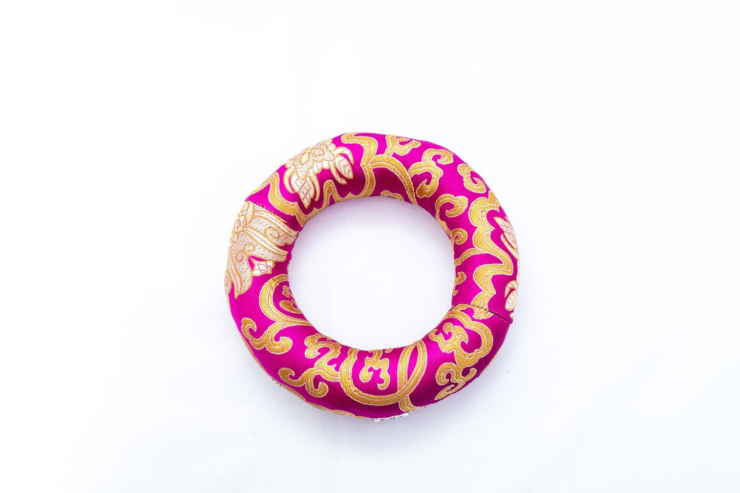 Ring singing bowl cushion in pink