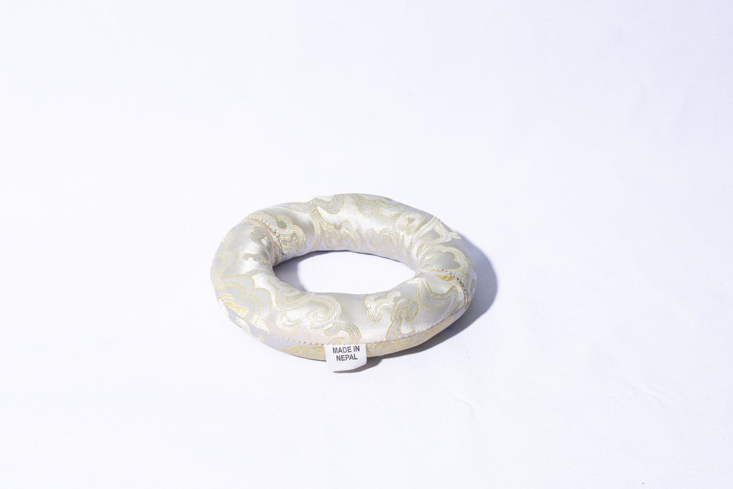 Ring singing bowl cushion in white