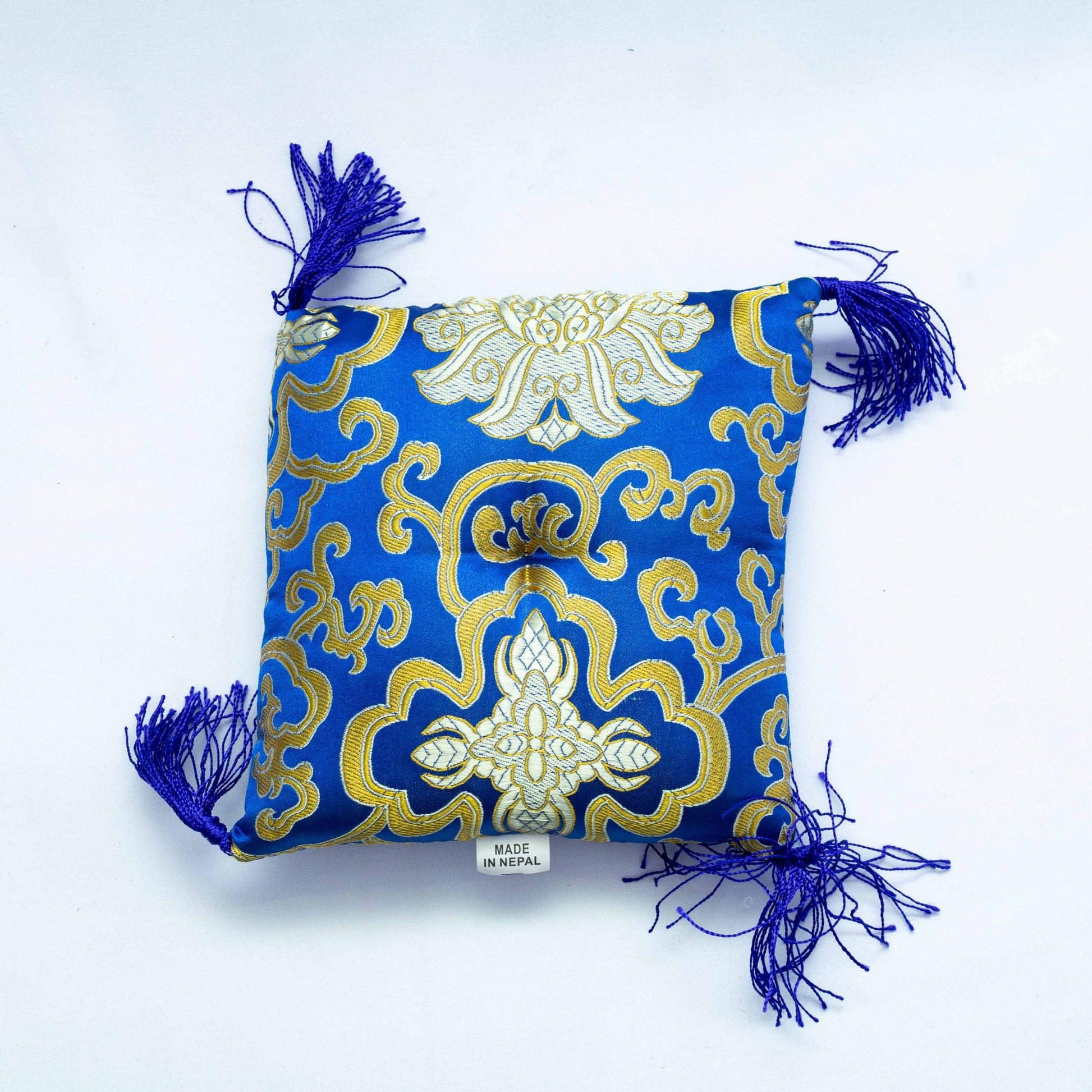 Square singing bowl cushion in blue