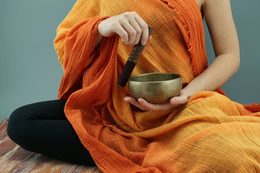 singing bowl with frequency spectrum in background