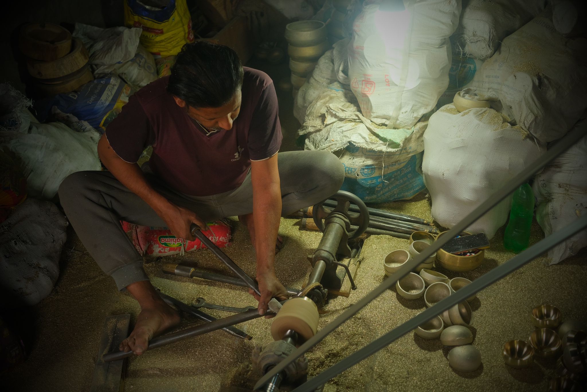 Artisan handcrafting a singing bowl in Nepal