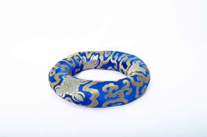 Ring singing bowl cushion in blue