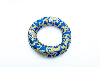 Ring singing bowl cushion in blue